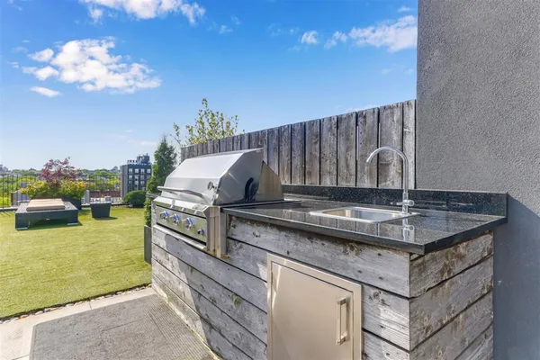 a view of a patio with couches table and chairs and potted plants