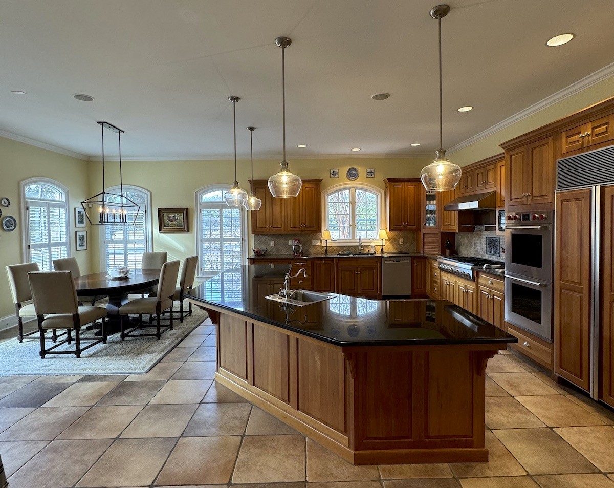 3062 Lower River Road Southeast Decatur, AL 35603 - Photo 27 of 70 a kitchen with stainless steel appliances granite countertop a stove a sink a oven a dining table and chairs