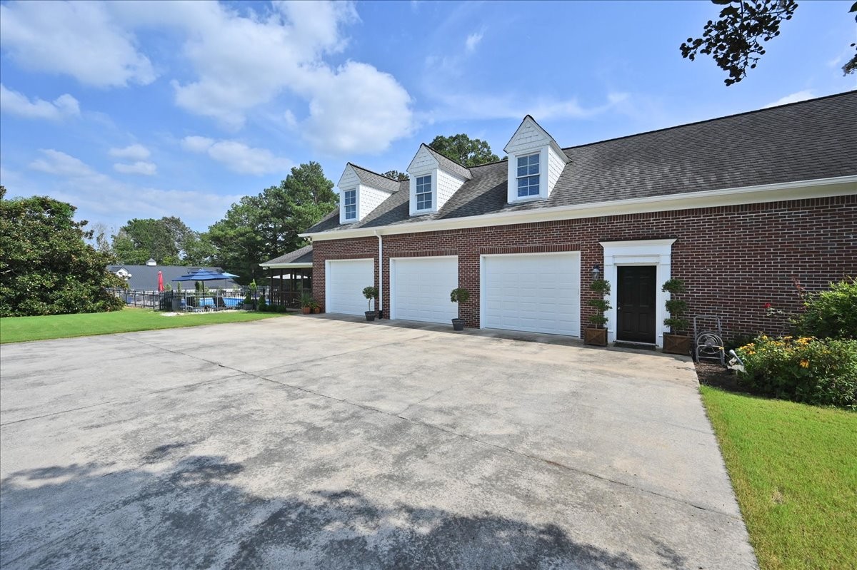 3062 Lower River Road Southeast Decatur, AL 35603 - Photo 5 of 70 a front view of a house with a yard and garage