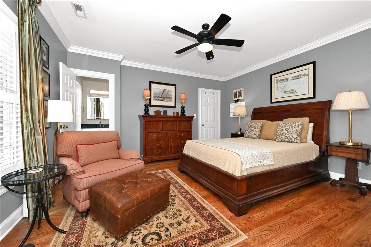 3062 Lower River Road Southeast Decatur, AL 35603 - Photo 51 of 70 a bedroom with a bed and wooden floor