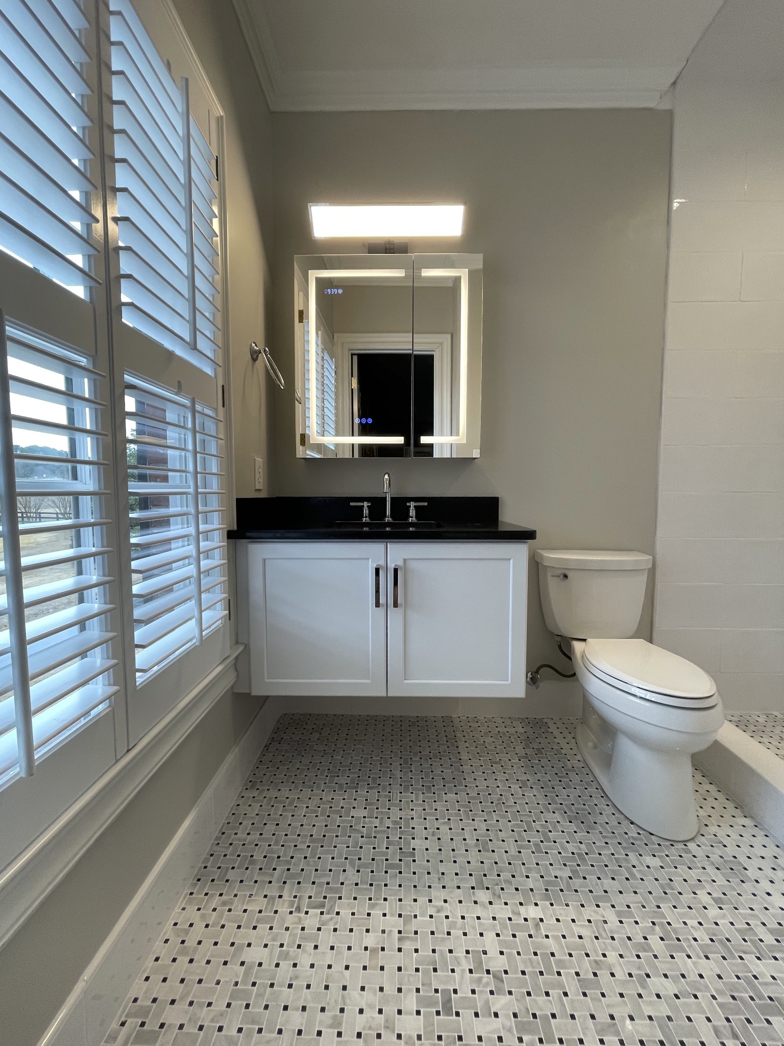 3062 Lower River Road Southeast Decatur, AL 35603 - Photo 53 of 70 a bathroom with a toilet a sink and a mirror