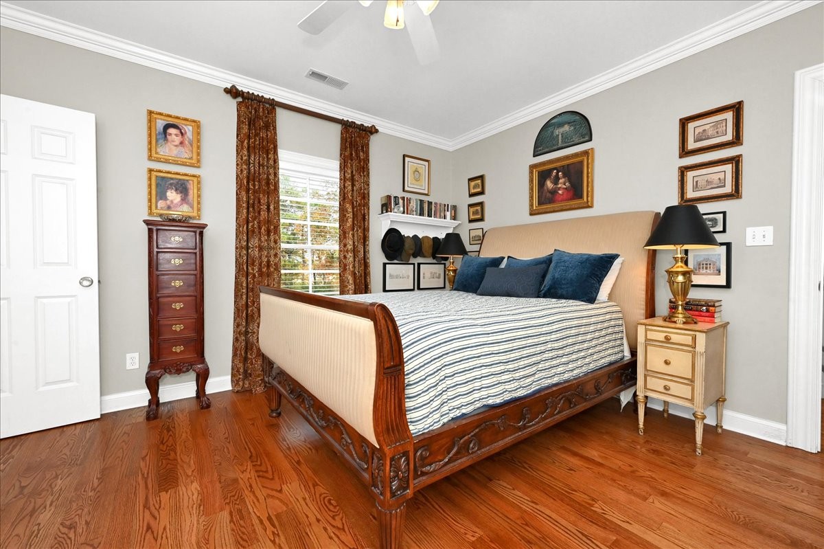 3062 Lower River Road Southeast Decatur, AL 35603 - Photo 55 of 70 a bedroom with a bed and a dresser next to a window