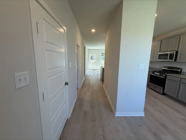 a view of a kitchen from the hallway