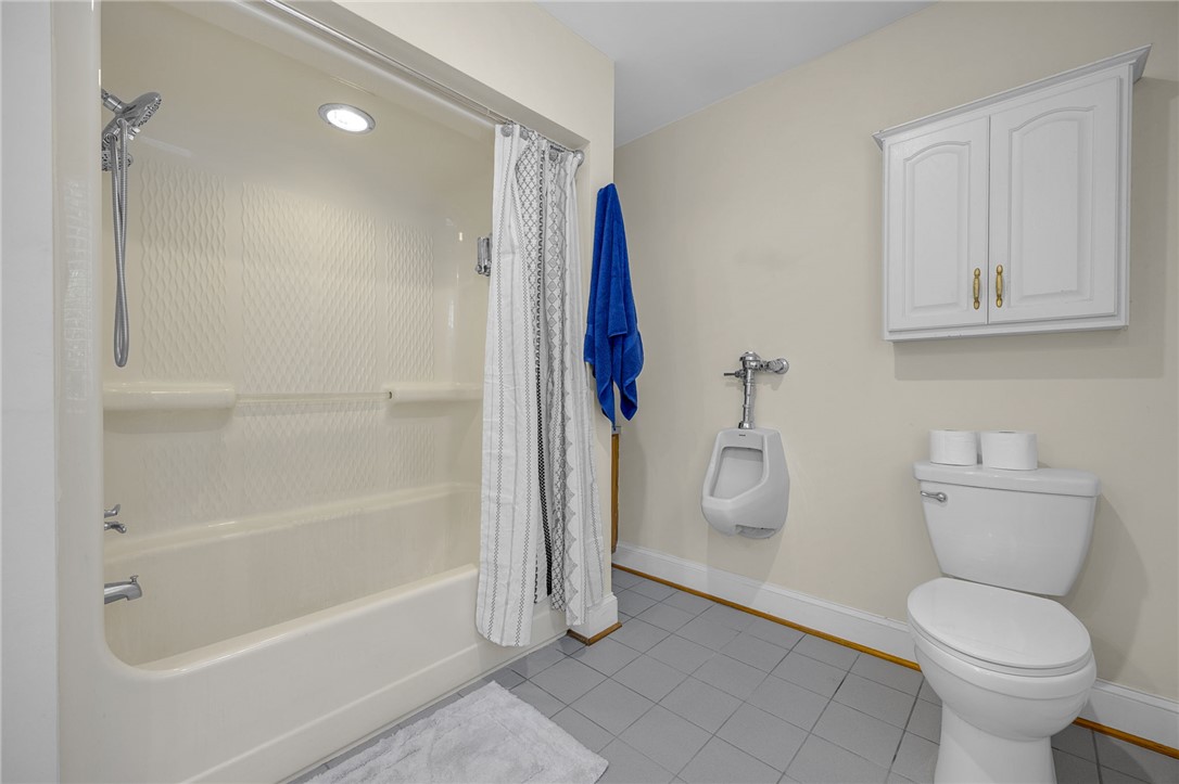 218 Northridge Drive Anderson, SC 29621 - Photo 26 of 50 Functional full bathroom featuring a tub-shower combination, modern toilet, and convenient wall-mounted storage.