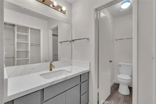 a bathroom with a toilet and a sink