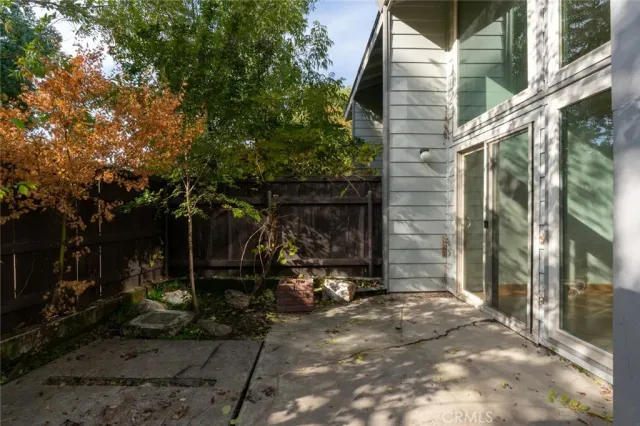 a view of a house with backyard from a patio
