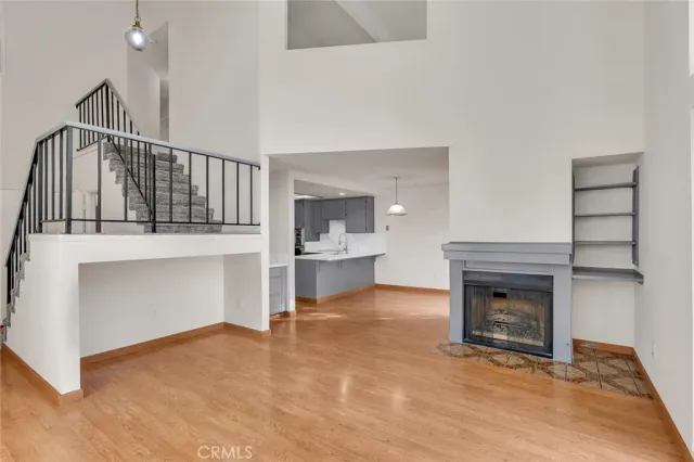 a view of a room with wooden floor and cabinet
