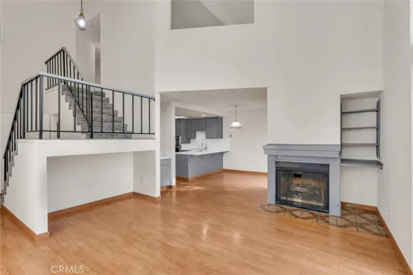 a view of staircase with lots of frames on wall