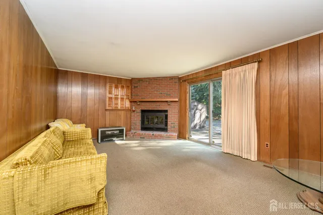 a bathroom with a toilet sink vanity and mirror