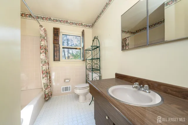 a view of room with window and hardwood floor