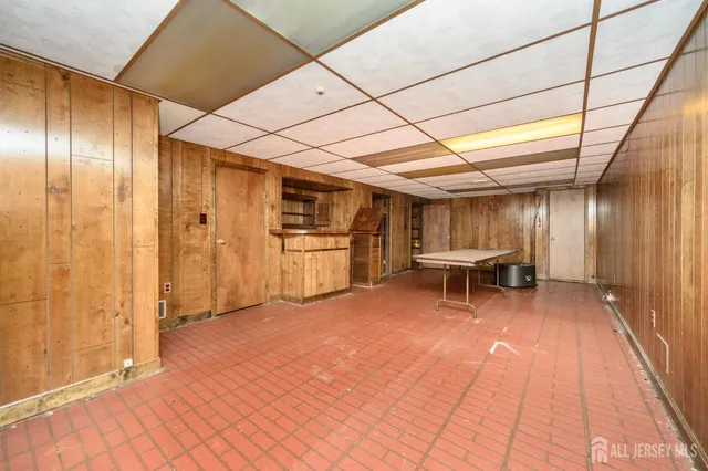 a spacious bathroom with a sink and a mirror