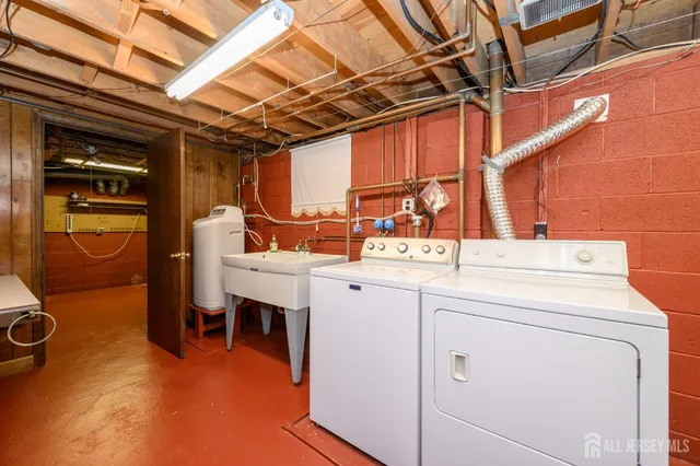 a view of a house with a backyard and tree