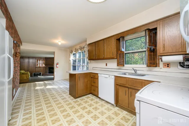a view of a kitchen with a sink and a window