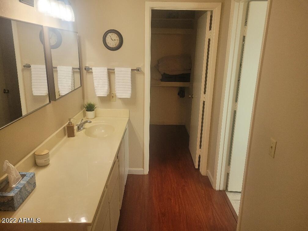14300 West Bell Road, Unit 513 Surprise, AZ 85374 - Photo 17 of 23 a bathroom with a sink and a mirror