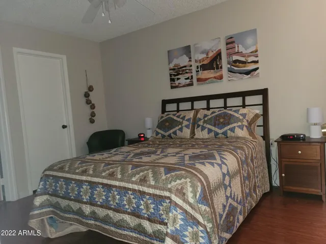 a bedroom with a bed and cabinet