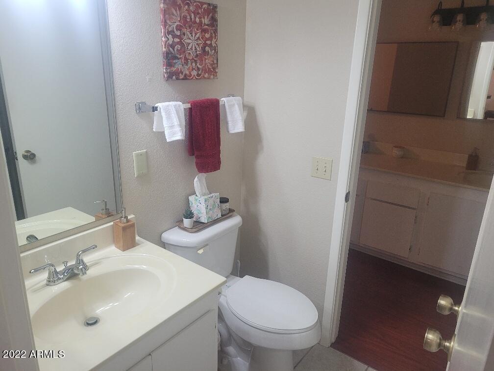 14300 West Bell Road, Unit 513 Surprise, AZ 85374 - Photo 21 of 23 a bathroom with a sink and a toilet