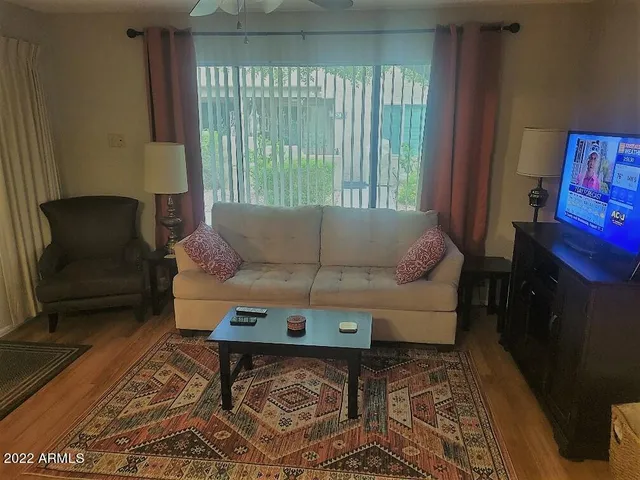 a living room with furniture and a window