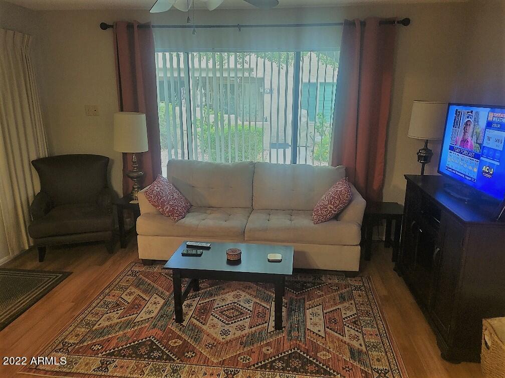 14300 West Bell Road, Unit 513 Surprise, AZ 85374 - Photo 6 of 23 a living room with furniture and a window