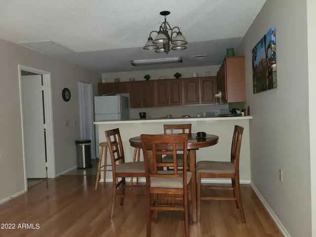 a view of kitchen with cabinets and wooden floor
