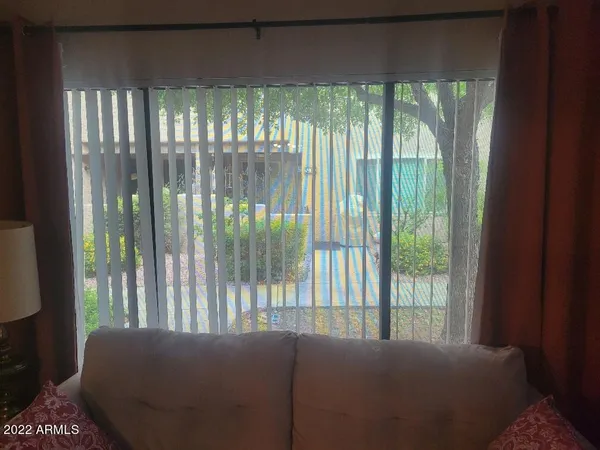 a view of a bedroom with windows