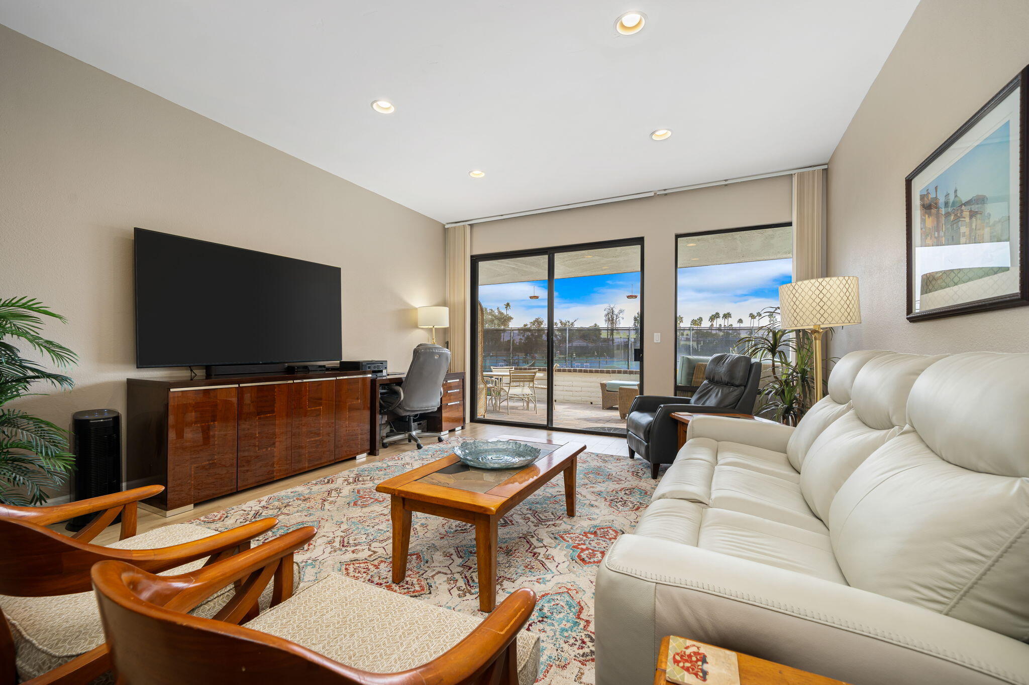 21 Toledo Drive Rancho Mirage, CA 92270 - Photo 10 of 35 a living room with furniture and a flat screen tv