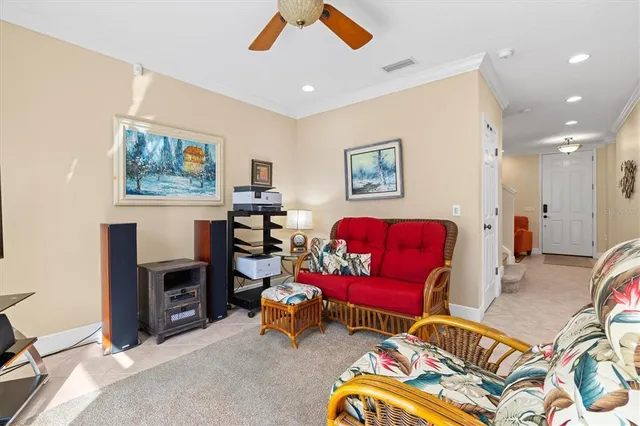 a view of a dining room with furniture and a chandelier