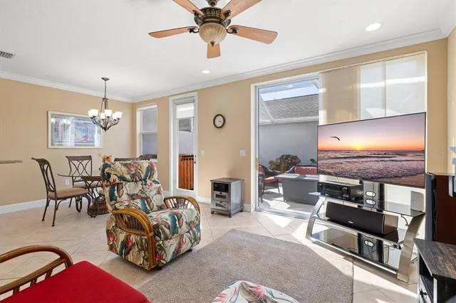 a view of a dining room with furniture and a chandelier