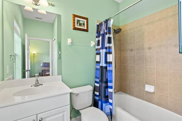 an aerial view of a house with a lake view