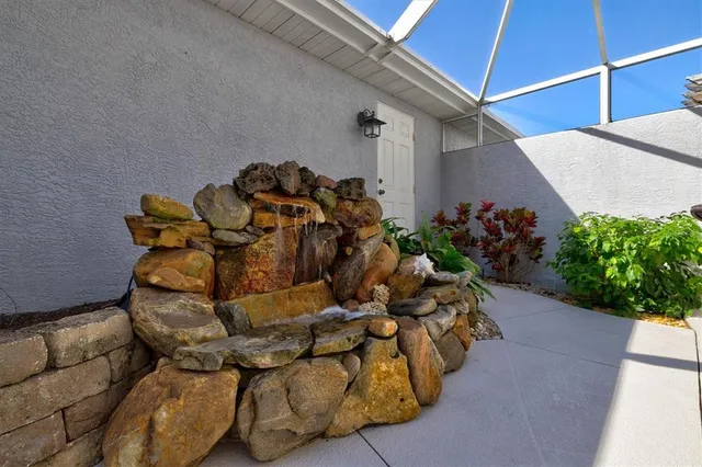 a view of a lake with a house in the background