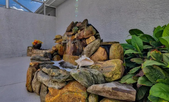swimming pool view with a seating space