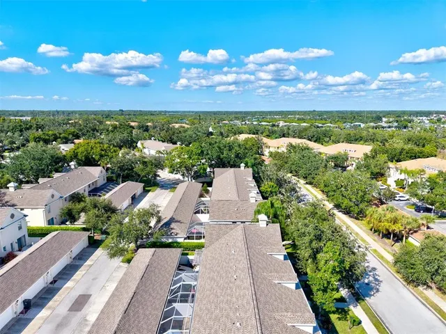 a view of swimming pool with seating space and lake view