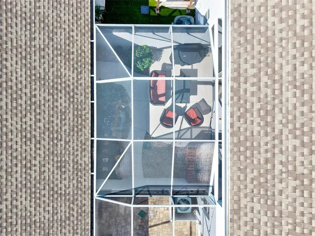 a view of a sign in a garden next to a lake