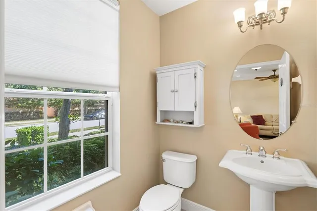 a large kitchen with kitchen island a sink stainless steel appliances and cabinets