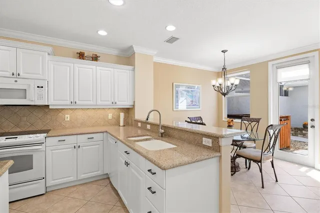 a spacious bathroom with a granite countertop sink and a mirror