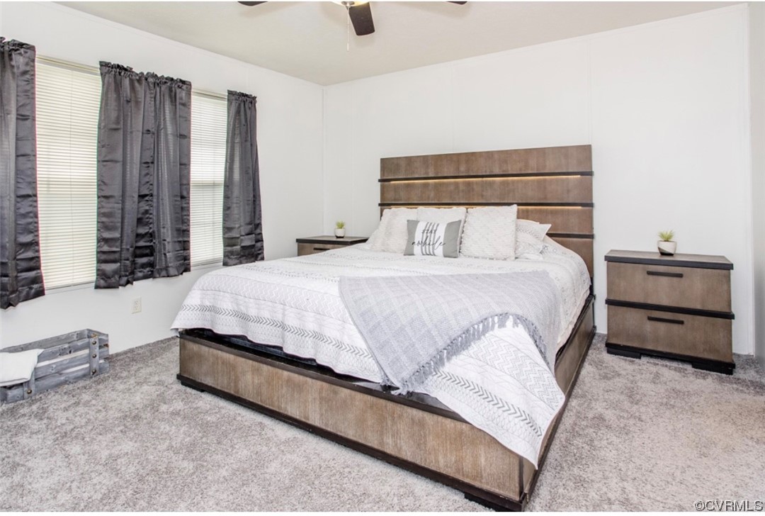 6302 Grubby Road Wilsons, VA 23894 - Photo 12 of 19 a bedroom with a bed and a night stand