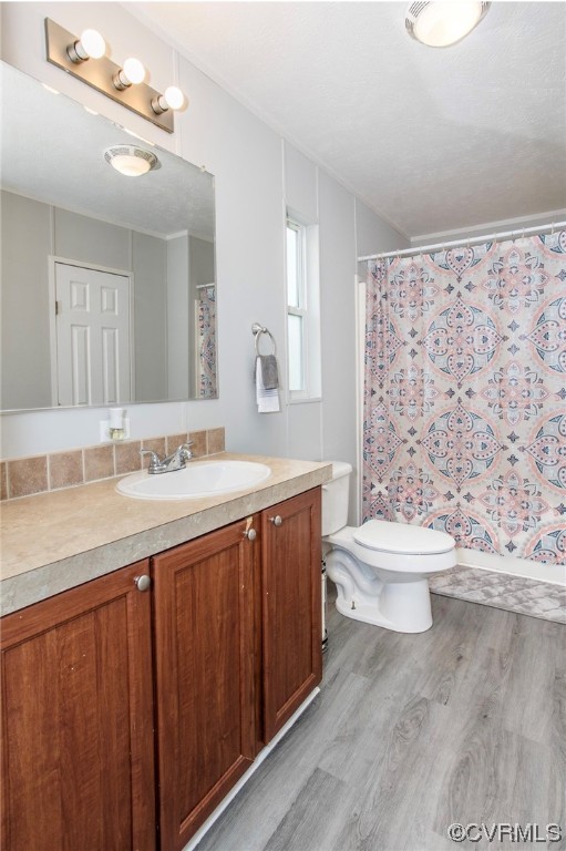 6302 Grubby Road Wilsons, VA 23894 - Photo 15 of 19 a bathroom with a granite countertop toilet sink and mirror