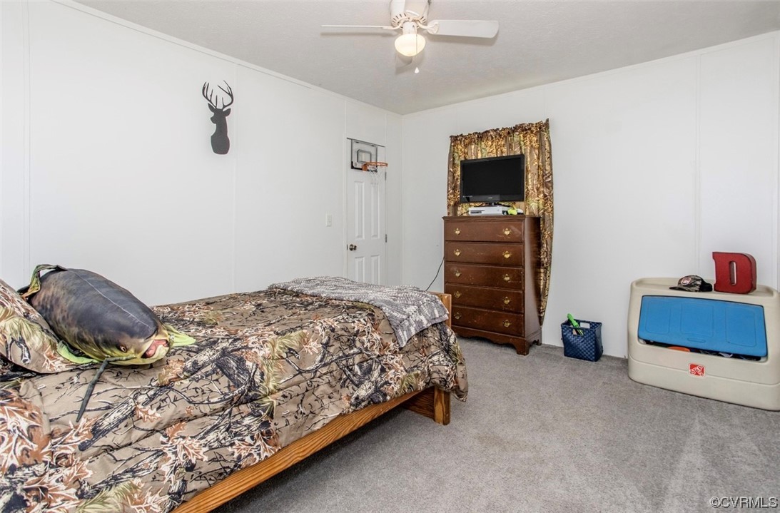 6302 Grubby Road Wilsons, VA 23894 - Photo 18 of 19 a bedroom with a bed and a window