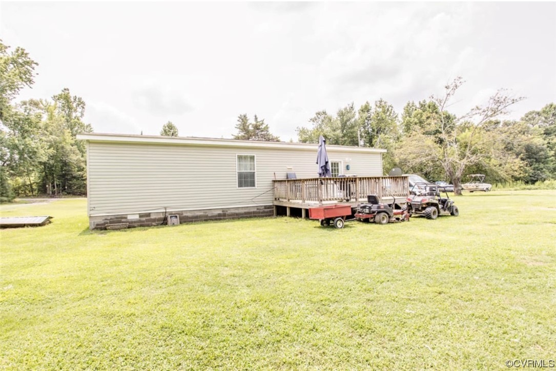 6302 Grubby Road Wilsons, VA 23894 - Photo 2 of 19 a car parked in front of a house with a yard