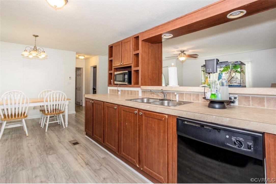 6302 Grubby Road Wilsons, VA 23894 - Photo 5 of 19 a spacious bathroom with a granite countertop sink and a mirror
