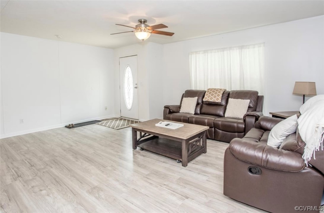 6302 Grubby Road Wilsons, VA 23894 - Photo 10 of 19 a living room with furniture and a wooden floor