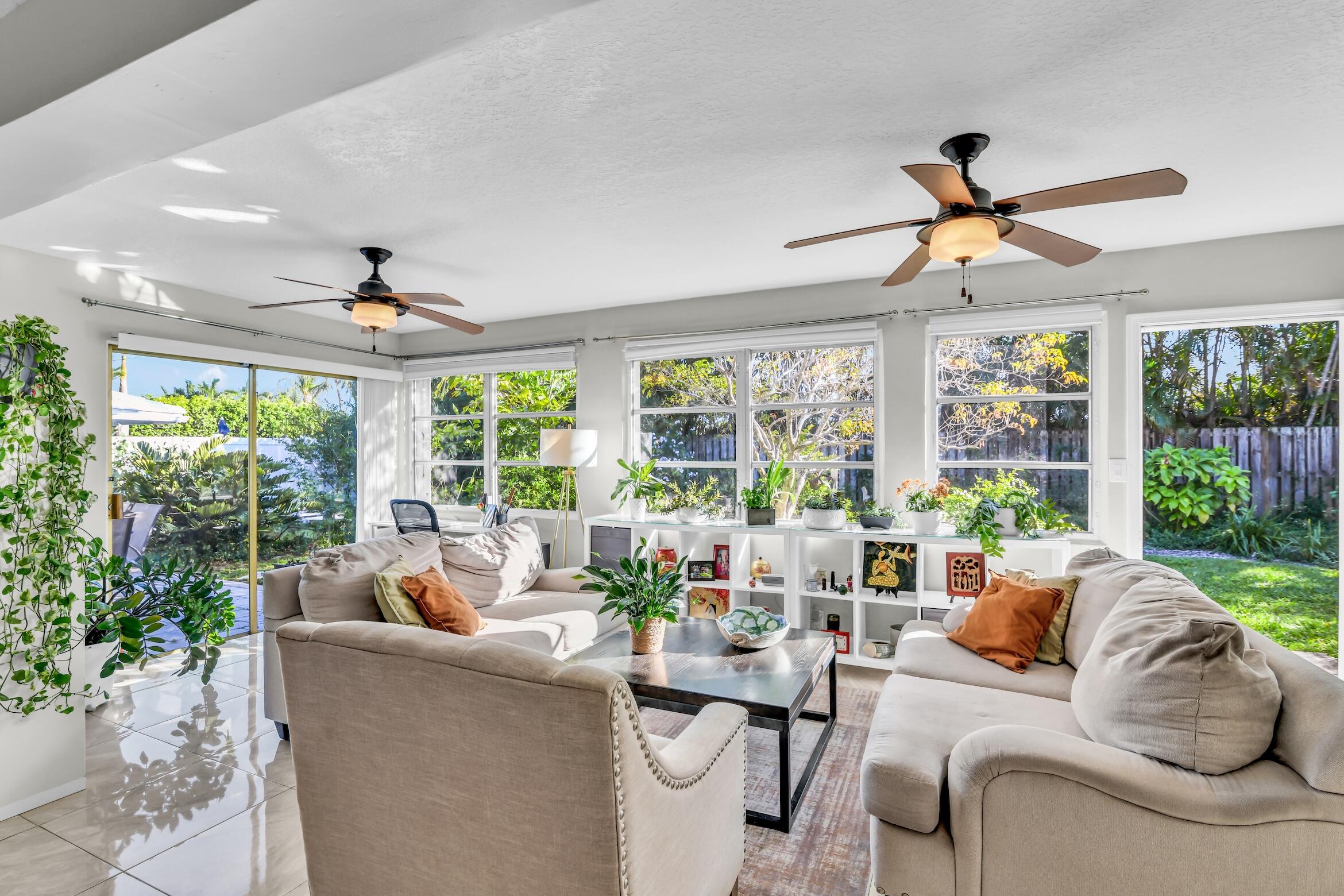 1290 Southwest 8th Street Boca Raton, FL 33486 - Photo 12 of 36 a living room with furniture and a large window