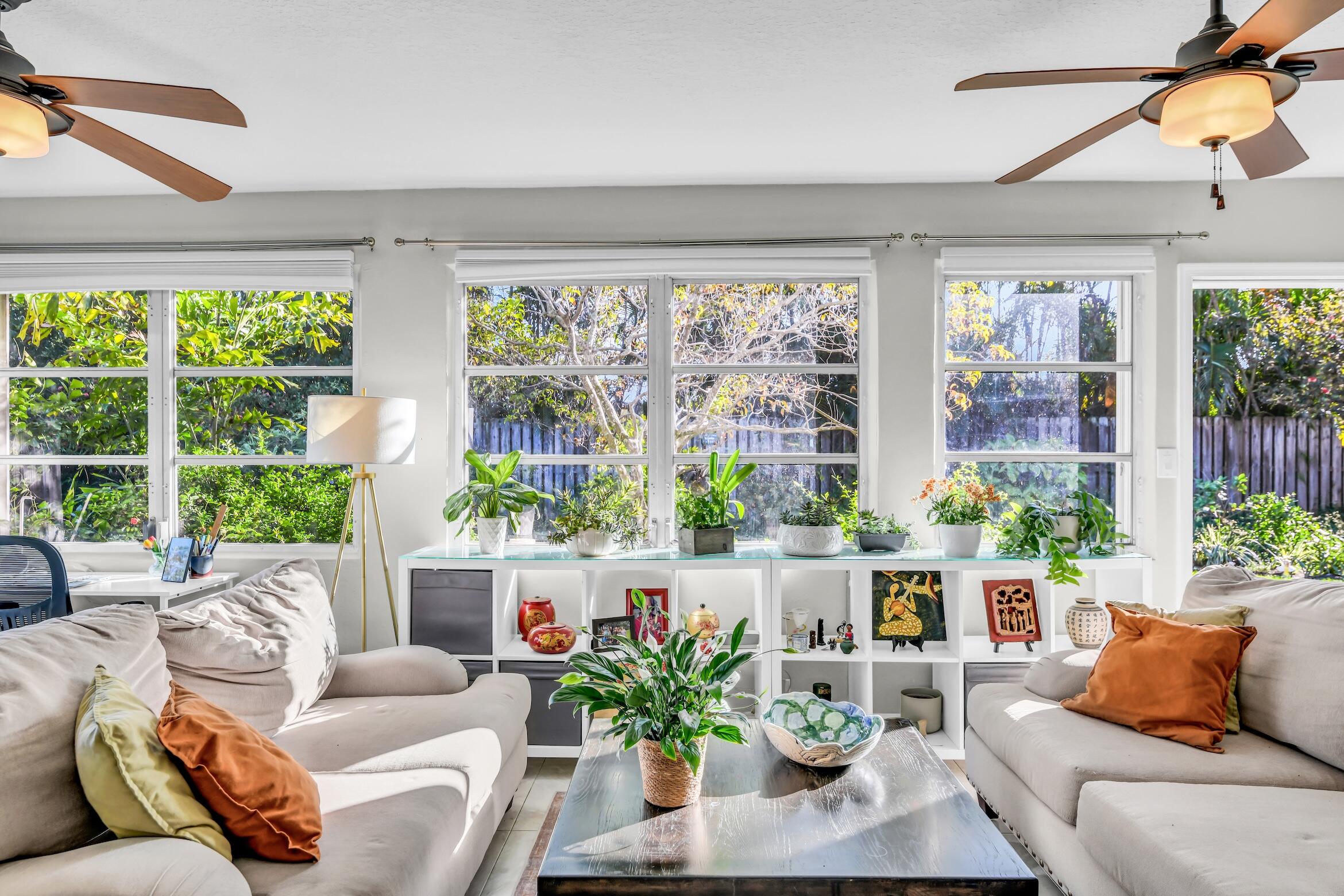 1290 Southwest 8th Street Boca Raton, FL 33486 - Photo 14 of 36 a living room with furniture and a large window