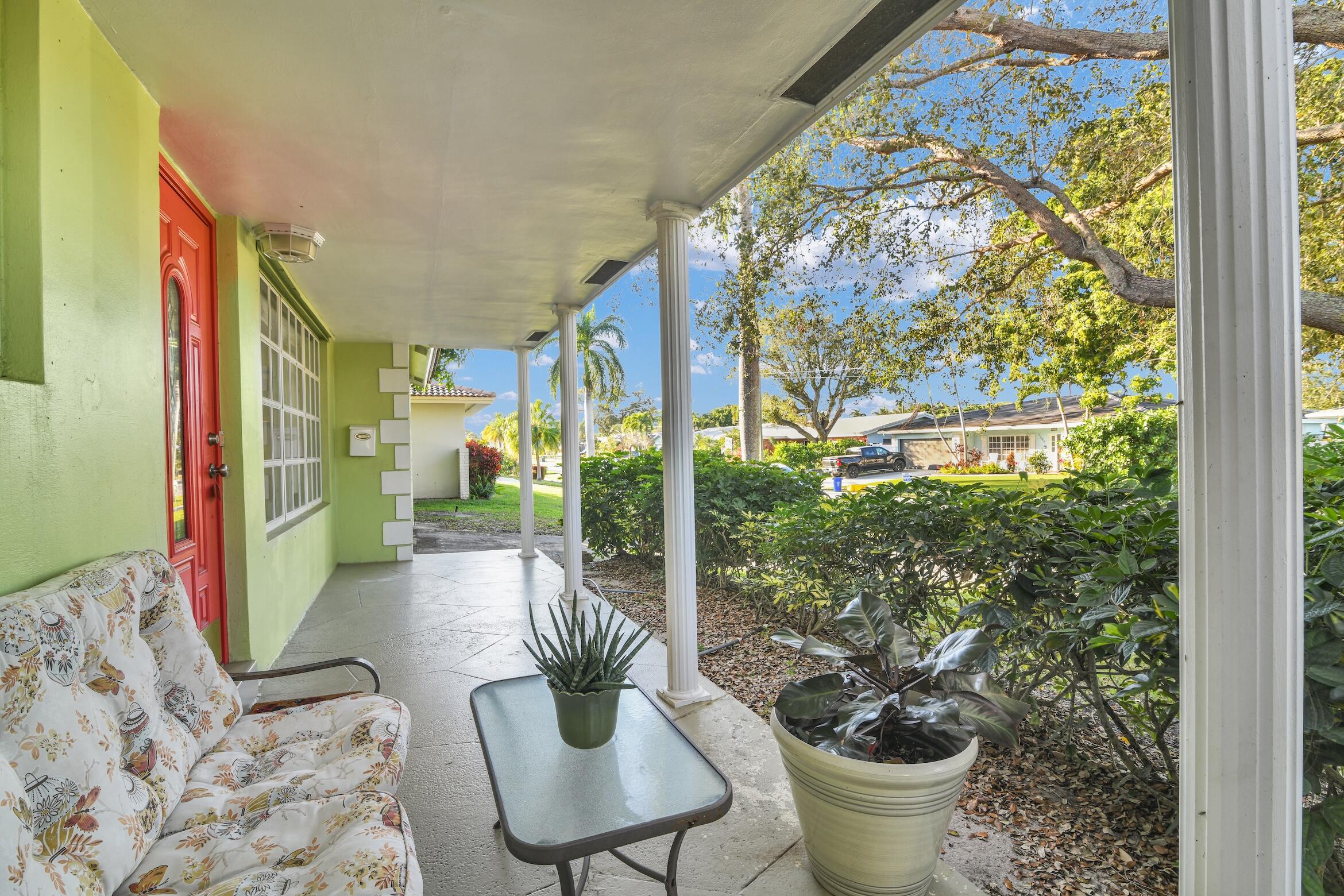 1290 Southwest 8th Street Boca Raton, FL 33486 - Photo 3 of 36 a room with furniture and a potted plant