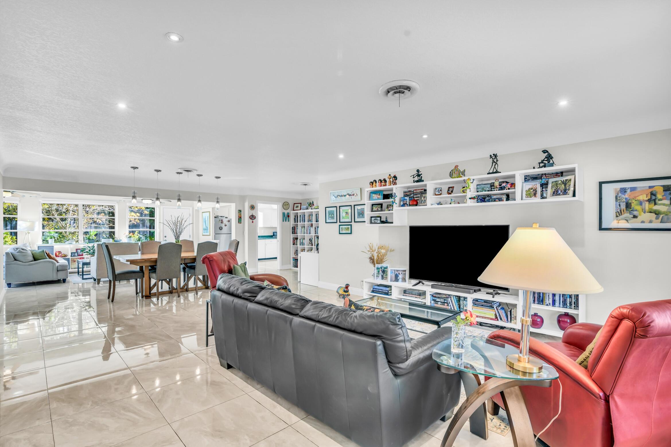 1290 Southwest 8th Street Boca Raton, FL 33486 - Photo 5 of 36 a living room with furniture and a flat screen tv