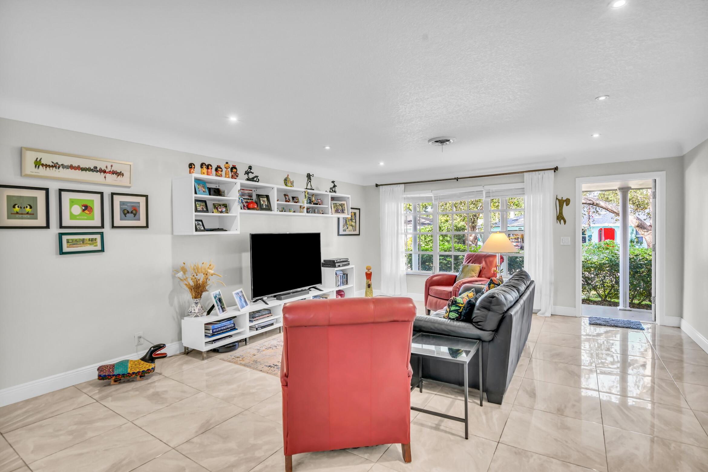 1290 Southwest 8th Street Boca Raton, FL 33486 - Photo 7 of 36 a view of a livingroom with workspace and a window