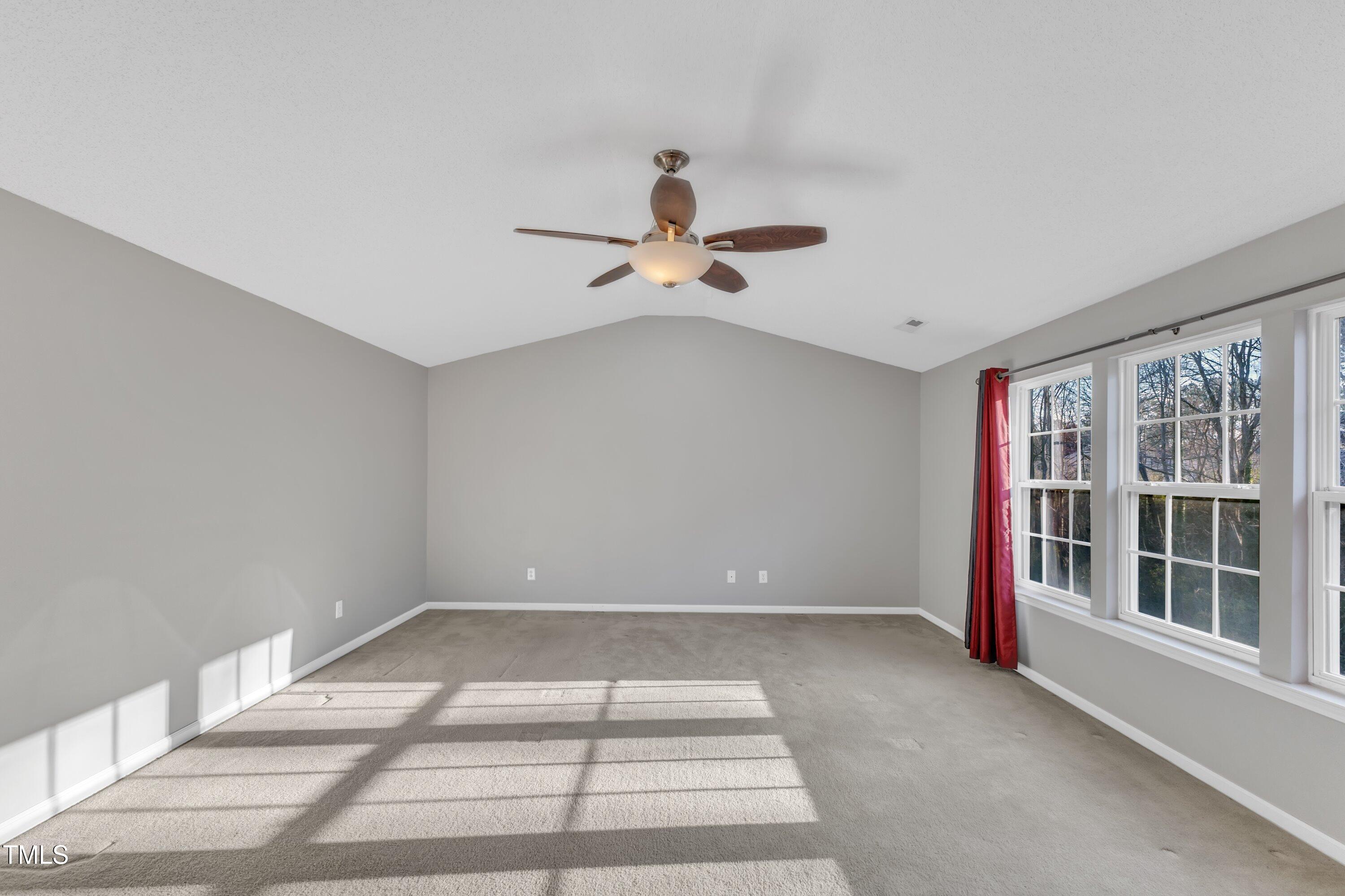 3408 Dutchman Road Raleigh, NC 27610 - Photo 36 of 54 a view of room with a ceiling fan and window