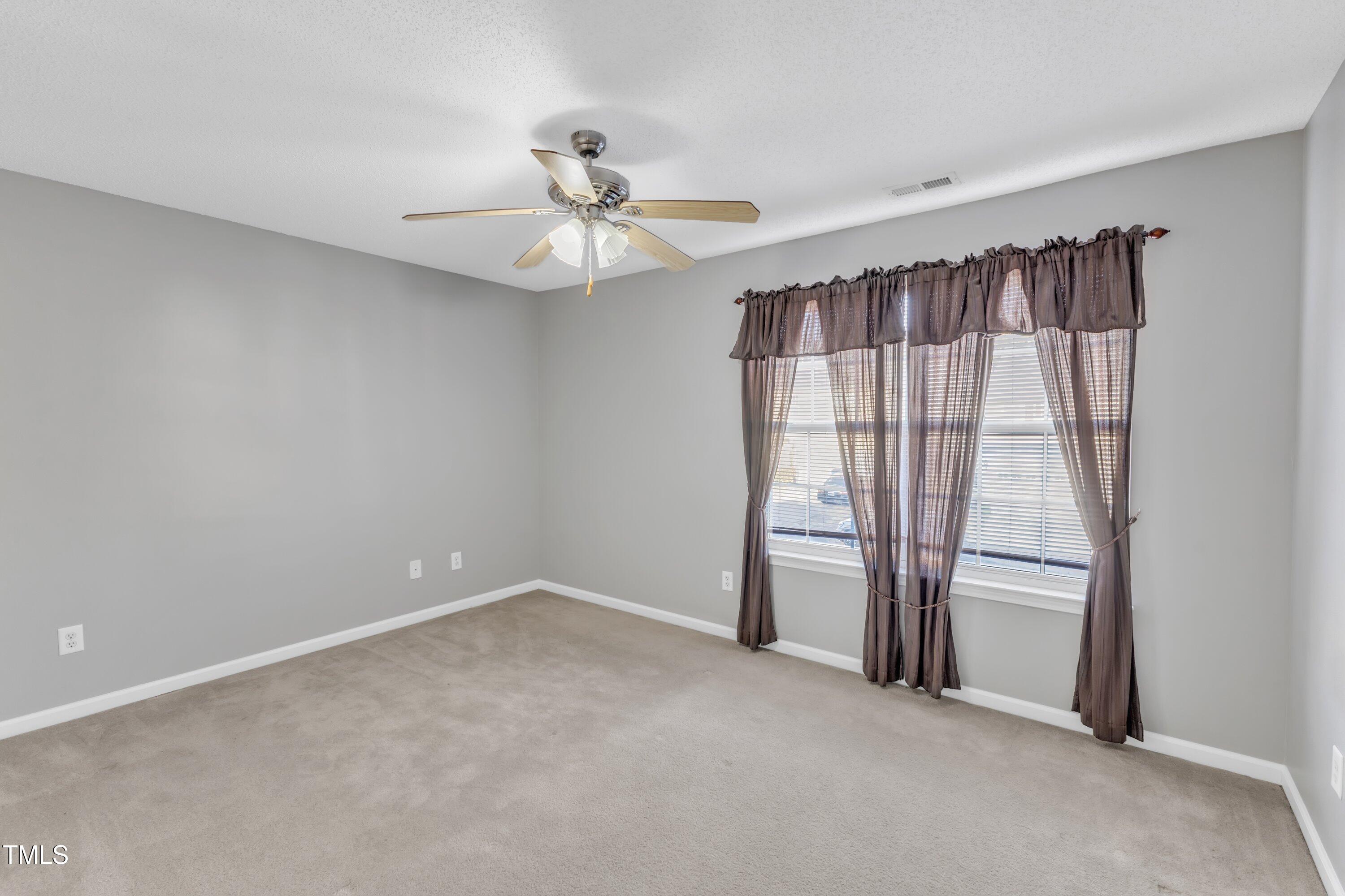 3408 Dutchman Road Raleigh, NC 27610 - Photo 45 of 54 a view of an empty room with a window