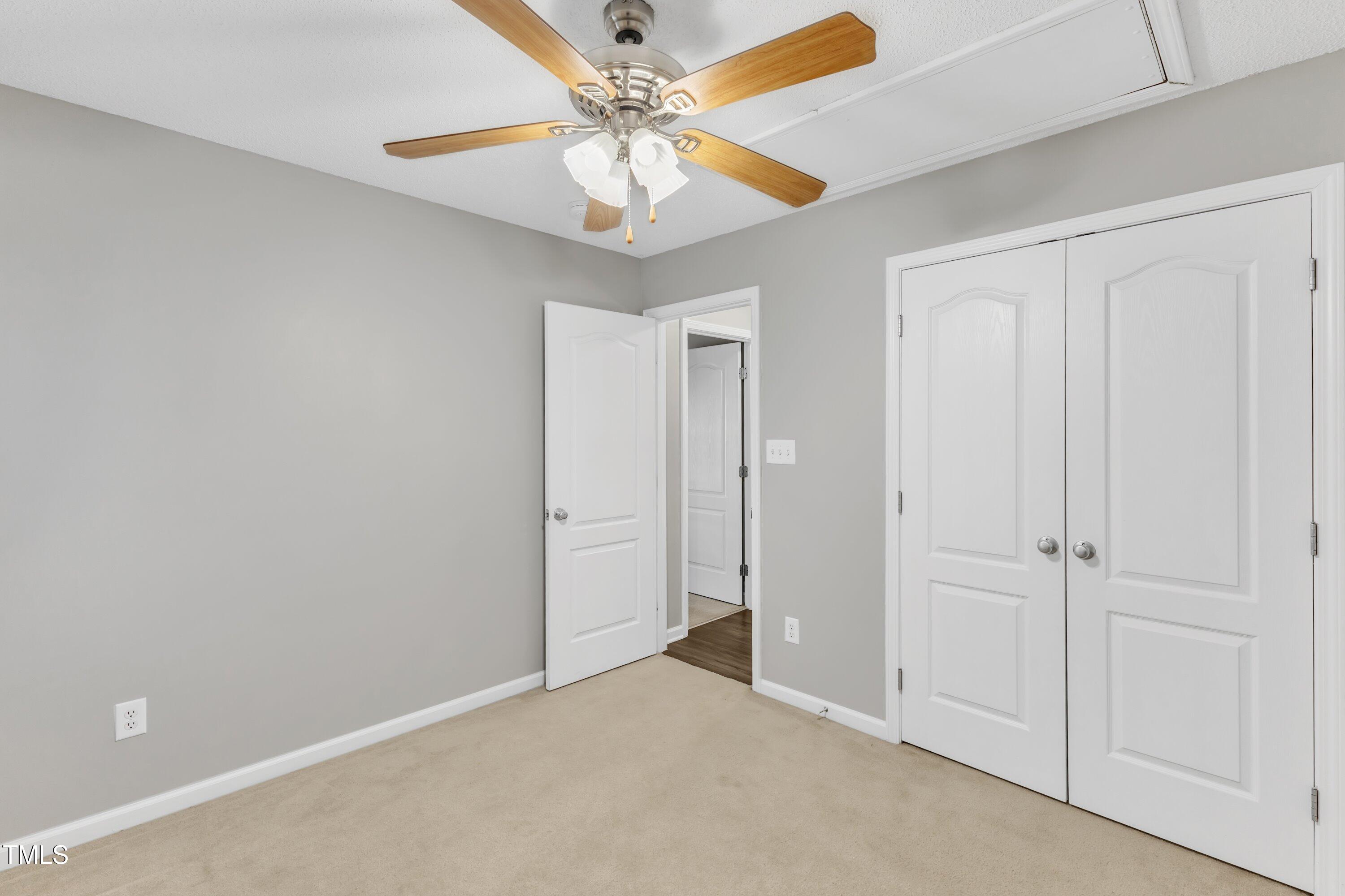 3408 Dutchman Road Raleigh, NC 27610 - Photo 48 of 54 an empty room with chandelier fan