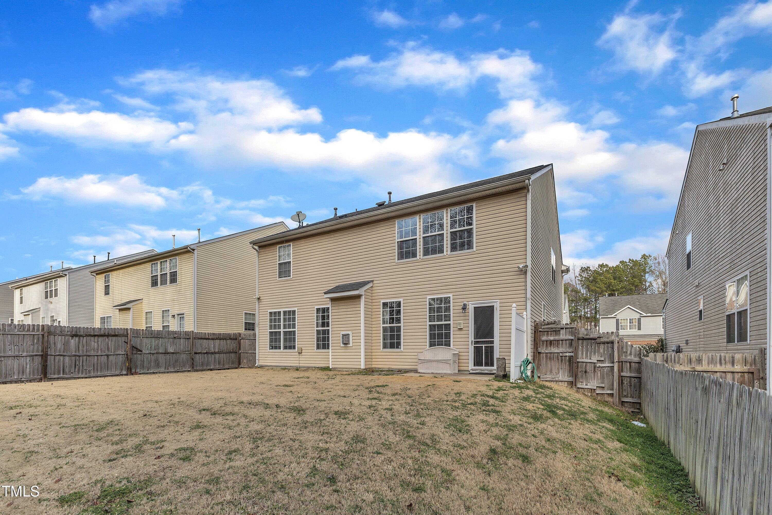 3408 Dutchman Road Raleigh, NC 27610 - Photo 51 of 54 a view of a house with a backyard