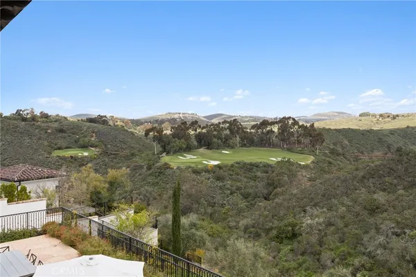 a view of a house with a mountain in the background